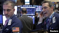 Traders work on the floor of the New York Stock Exchange, Feb. 19, 2016.