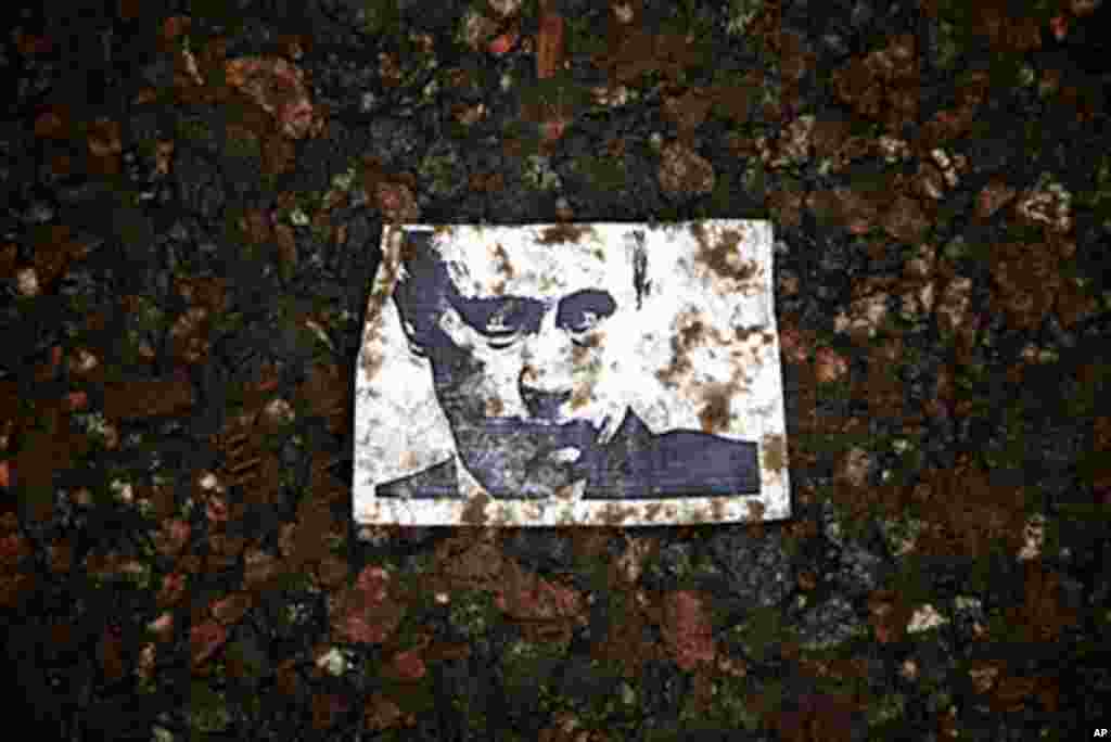 A xeroxed portrait of Prime Minister Vladimir Putin stepped on by protesters at the February 4 rally for fair elections in Moscow, February 4, 2012. (VOA - Y. Weeks)