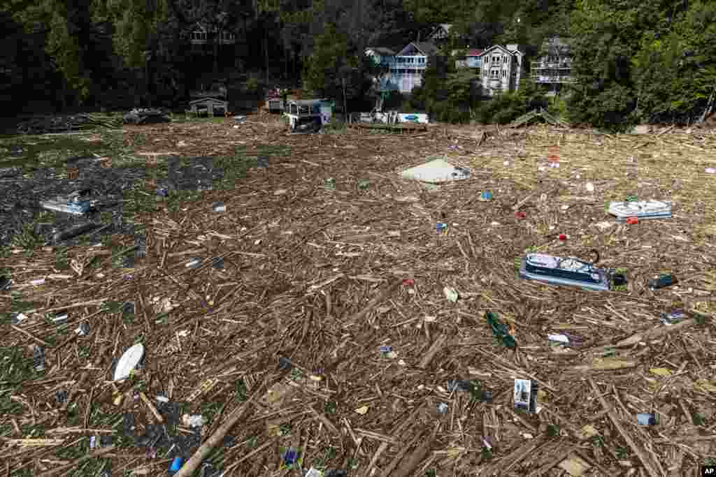 Debris is strewn on the lake in the aftermath of Hurricane Helene, Oct. 2, 2024, in Lake Lure, North Carolina.