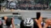 FILE PHOTO: Police stand on a road during an anti-coup protest in Mandalay, Myanmar, March 3, 2021. 