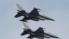 Polish Air Force F-16 fighter jets fly in formation during the Clear Sky 2018 multinational military..