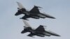 Polish Air Force F-16 fighter jets fly in formation during the Clear Sky 2018 multinational military..