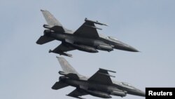 Polish Air Force F-16 fighter jets fly in formation during the Clear Sky 2018 multinational military..