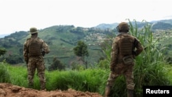 FILE - Members of the Armed Forces of the Democratic Republic of the Congo stand guard against the M23 rebel group in Lubero, North Kivu province, Oct. 27, 2024. The rebels have seized Masisi near the provincial capital Goma, local politicians said on Jan. 5, 2025.