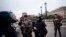 Armed police officers and soldiers patrol after an incident at the police headquarters after in Paris, Oct. 3, 2019. 