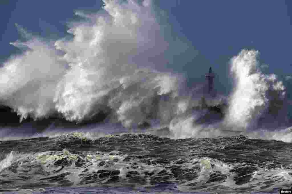 Huge waves crash on the San Esteban de Pravia seafront in the northern Spanish region of Asturias.