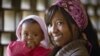 Esther Njeri, 20, and daughter Shanice, 6 months, arrive for a family planning visit at the Makadara district hospital in Nairobi, Kenya, Dec. 16, 2009. (©Bill & Melinda Gates Foundation/Olivier Asselin)