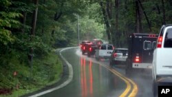 FILE - The motorcade for U.S. President Donald Trump heads back to the White House from his trip to Camp David, Sunday, June 3, 2018, near Thurmont, Md.
