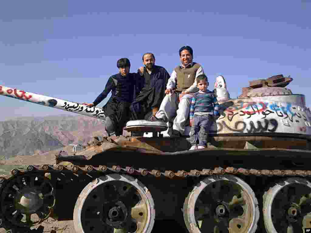 Honorable Mention - Posing on an old tank,Naghlo, Kabul, Afghanistan (Etisalat Khalid)