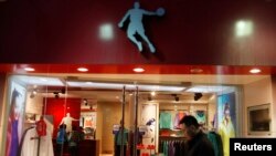 A man walks past a Qiaodan sports store in downtown Shanghai in 2012. Michael Jordan sued Qiaodan, accusing the company of using his name without permission. (REUTERS/Aly Song)