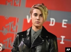 FILE - Justin Bieber arrives at the MTV Video Music Awards in Los Angeles.