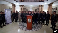 Philippine military chief Gen. Gregorio Catapang, center, talks to reporters about the situation of Filipino peacekeepers in Golan Heights during a press conference at Camp Aguinaldo military headquarters in suburban Quezon city, Philippines, Aug. 31,