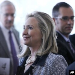 Secretary of State Hillary Rodham Clinton greets audience member after speaking on American global leadership, Wednesday, Oct. 12, 2011, in Washington.