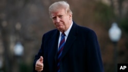 President Donald Trump gives the thumbs-up as he arrives on Marine One on the South Lawn of the White House in Washington, Feb. 8, 2019, as he returns from his annual physical exam at Walter Reed National Military Medical Center.