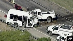 Authorities respond to a deadly crash involving a van carrying church members and a pickup on a highway in the U.S. state of Texas, March 29, 2017.