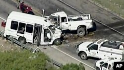 Authorities respond to a deadly crash involving a van carrying church members and a pickup on U.S. 83 outside Garner State Park in northern Uvalde County, Texas, March 29, 2017. The group of senior adults from First Baptist Church of New Braunfels, Texas