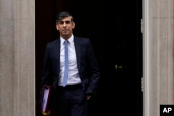 FILE— Britain's Prime Minster Rishi Sunak departs 10 Downing Street to go to the House of Commons for his weekly Prime Minister's Questions in London, March 13, 2024.