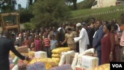 FILE - Internally displaced persons receive gifts from well wishers in Yaounde, Cameroon, May 12, 2019. 