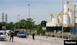 French Gendarmes block the access road to the industrial area of Saint-Quentin-Fallavier, outside Lyon, France, June 26, 2015.