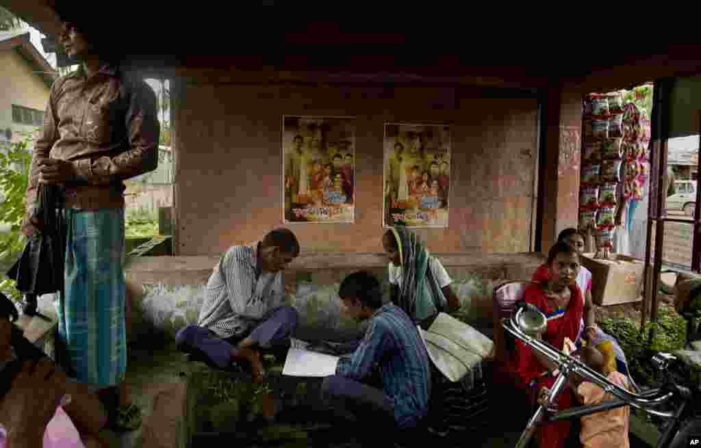 People whose names were left out in the National Register of Citizens (NRC) draft fill up forms to file appeals near a NRC center on the outskirts of Gauhati, Assam state, India. A draft list of citizens in Assam, released in July, put nearly 4 million people on edge to prove their Indian nationality.