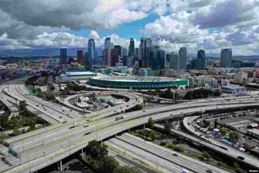 An aerial view shows freeways leading into downtown Los Angeles after California issued a stay-at-home order due to the coronavirus pandemic, March 23, 2020.