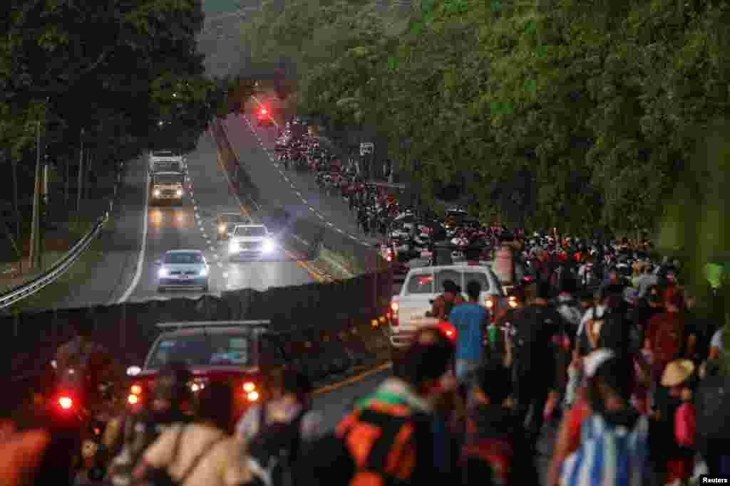 Migrants walk in a caravan bound for the northern border with the U.S., in Huehuetan, Mexico, Jan. 26, 2025. 