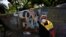Demonstrators block a street with a barricade to protest against a tax reform bill launched by President Ivan Duque, in Cali, Colombia, on May 3, 2021.