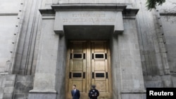 FILE - Security officials stand outside the main entrance to Mexico's Supreme Court of Justice in Mexico City, Mexico August 19, 2024. 