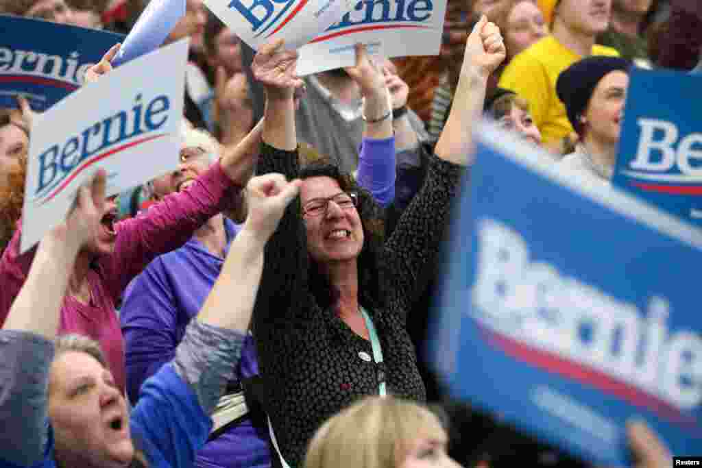 Supporters of Democratic U.S. presidential candidate Senator Bernie Sanders cheer for early results at his Super Tuesday night rally in Essex Junction, Vermont, March 3, 2020.