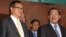 Cambodian Prime Minister Hun Sen, right, talks with the main Opposition Party leader Sam Rainsy, left, of Cambodia National Rescue Party, after their meeting in Senate headquarters in Phnom Penh, Cambodia, July 22, 2012. 