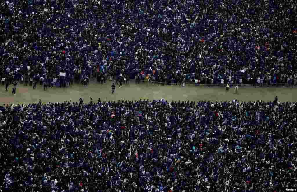 Anti-government protesters attend a demonstration on New Year&#39;s Day to call for better governance and democratic reforms in Hong Kong, China.