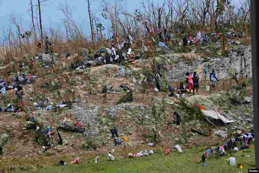 Displaced Haitian nationals take refuge on the grounds of the government complex in the aftermath of Hurricane Dorian on the Great Abaco island town of Marsh Harbor, Bahamas, Sept. 4, 2019.