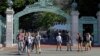 FILE - Students walk past Sather Gate on the University of California, Berkeley campus in Berkeley, Calif. 