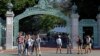 FILE - In this April 21, 2017 file photo, students walk past Sather Gate on the University of California, Berkeley campus in Berkeley, Calif. 