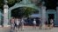 FILE - Students walk past Sather Gate on the University of California, Berkeley campus in Berkeley, Calif.