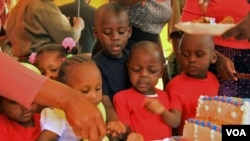 Children of female prisoners celebrate the opening of a new day care facility at the Langata Women's Prison in Nairobi, Jan. 23, 2013.