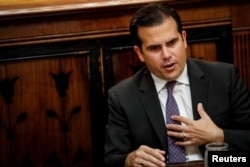 FILE - Puerto Rico Governor Ricardo Rossello speaks during an interview in New York City, Nov. 2, 2017.