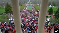 Thousands of teachers from across Kentucky gather outside the state Capitol to rally for increased funding and to protest last minute changes to their state funded pension system, April 2, 2018, in Frankfort, Ky. 
