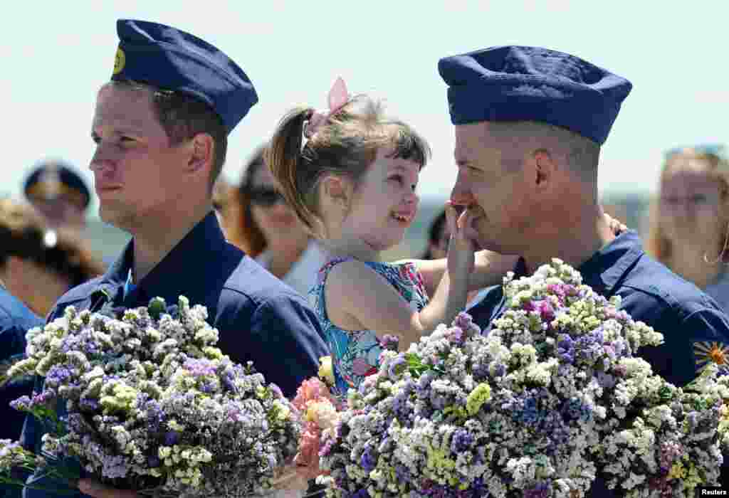 Su-25 fighter jet pilots, who took part in the Russian mission in Syria, attend a welcoming ceremony after landing at a military airport in Krasnodar Region, Russia.