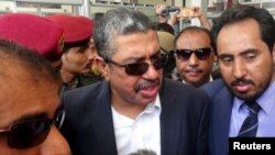 Yemen's Vice President Khaled Bahah, center, talks to reporters upon his arrival at Aden airport, August 1, 2015. 