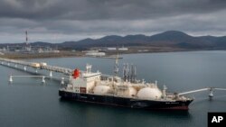 FILE - The tanker Sun Arrows loads its cargo of liquefied natural gas from the Sakhalin-2 project in the port of Prigorodnoye, Russia, on Oct. 29, 2021. 