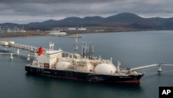 FILE - The tanker Sun Arrows loads its cargo of liquefied natural gas from the Sakhalin-2 project in the port of Prigorodnoye, Russia, on Oct. 29, 2021. 