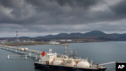 FILE - The tanker Sun Arrows loads its cargo of liquefied natural gas from the Sakhalin-2 project in the port of Prigorodnoye, Russia, on Oct. 29, 2021. 