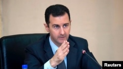 Syria's President Bashar al-Assad in seen in February 12, 2013, file photo