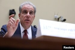FILE - U.S. Justice Department Inspector General Michael Horowitz testifies before the House Oversight and Government Reform Committee on Capitol Hill in Washington, Sept. 18, 2019.