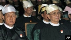 Burma President Thein Sein, right, and Vice President Thiha Thura Tin Aung Myint Oo are pictured in this February 2011 file photo. Burma's junta was officially disbanded after handing over power to a new so-called civilian government, March 30, 2011