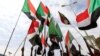 Sudanese women hold a banner bearing pictures of killed protesters during a demonstration called for by the Sudanese Professionals Association (SPA), in the capital Khartoum, Aug. 1, 2019.