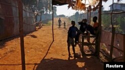 In this 2015 file photo, children shelter from the sun under a market stall in the Kibera slum of Kenya's capital Nairobi. (REUTERS/Darrin Zammit Lupi)