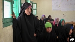 Teenaged girls attend an after-school discussion of female genital mutilation at the Sheik Nuur Primary School in Hargeisa, Somaliland on Feb. 16, 2014. 