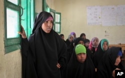 FILE - Teenaged girls attend an after-school discussion of female genital mutilation at the Sheik Nuur Primary School in Hargeisa, Somaliland on Feb. 16, 2014.